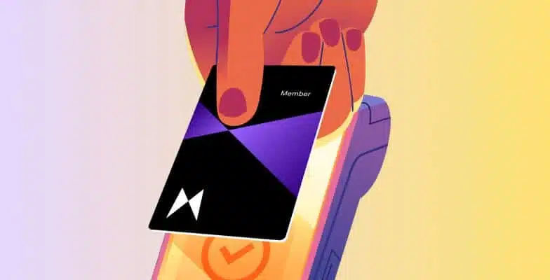 A hand using tap to pay with their Lighthouse Credit Union card